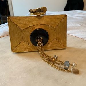 Mintsa gold and black clutch